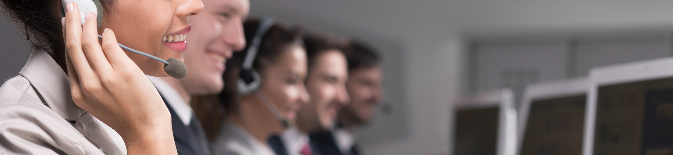 A woman wearing a headset and talking on a cell phone.
